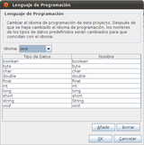 Ventana de la aplicación Visual Paradigm que sirve para seleccionar el lenguaje de programación a utilizar en el paso a código de las clases. En la zona superior de la ventana se puede leer el siguiente texto: Lenguaje de programación: Cambiar el idioma de programación de este proyecto. Después de que se haya cambiado el lenguaje de programación, los nombres de los tipos de datos predefinidos serán cambiados para que coincidan con el idioma. A continuación aparece la palabra idioma seguida de un selector en el que aparece la palabra Java. Debajo hay una tabla con los siguientes datos: Cabecera: Tipo de datos y Nombre. Valores: boolean y boolean, en la siguiente fila byte y byte, en la siguiente fila char y char, en la siguiente fila double y double, en la siguiente fila  float y float, en la siguiente fila, int e int, en la siguiente fila  long y long, en la siguiente fila short y short, en la siguiente fila  string y String, en la siguiente fila void y void. A continuación aparecen botones para Añadir, Borrar, OK y Cancelar. 
